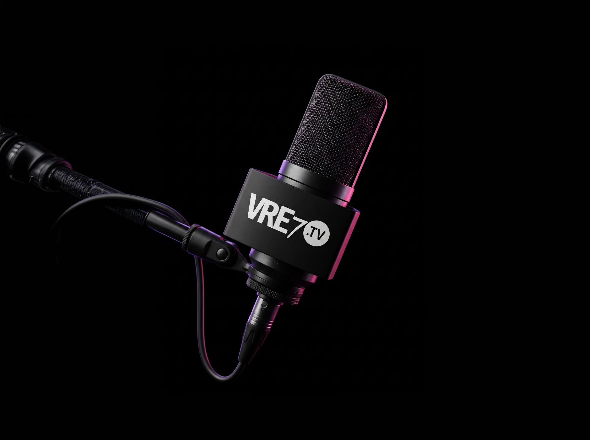 Professional studio microphone with a VRE7.TV mic flag against a dark background